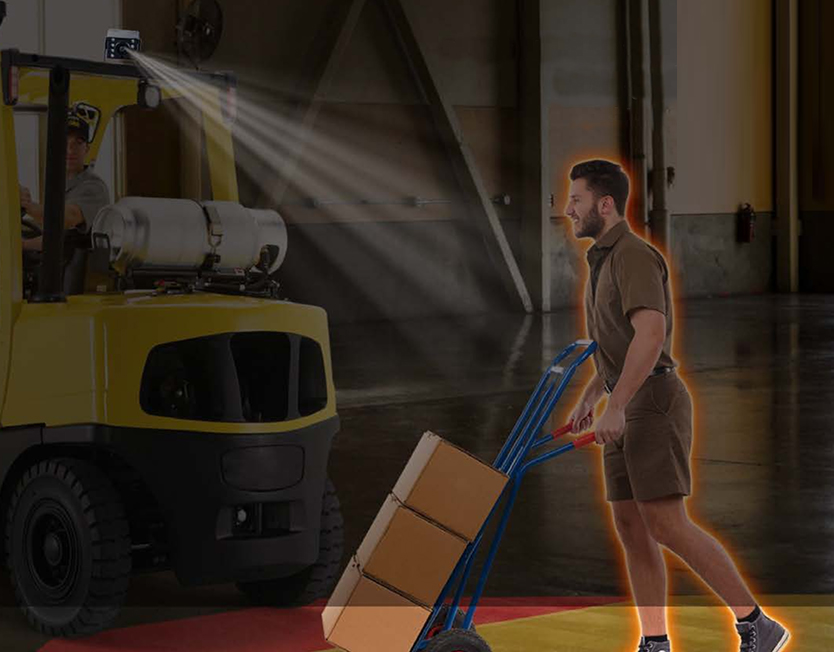 Forklift with a mast-mounted AI safety camera detecting a pedestrian pushing a hand trolley across its path in a warehouse